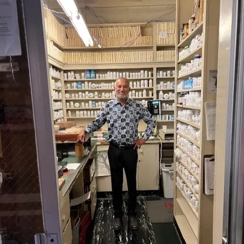 Pharmacist helping a patient.